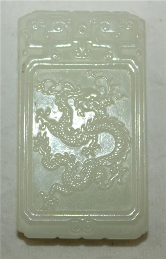 A Chinese pale celadon jade plaque, 5.7cm